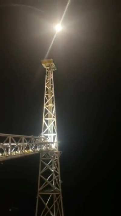 An offshore worker lighting a flare on Equinor&rsquo;s Sleipner A installation in the North Sea.