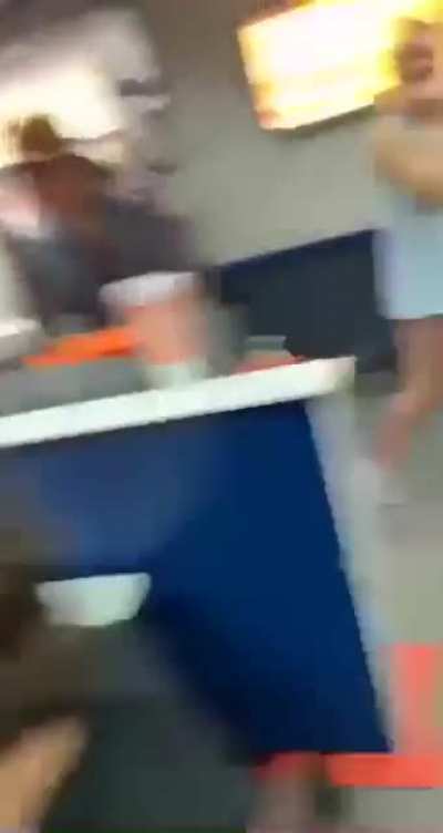 Guy holds door open while person in truck starts "rolling coal" into a restaurant filled with customers.