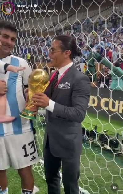 &ldquo;Salt Bae&rdquo; prying the World Cup trophy from Cristian Romero and his son.