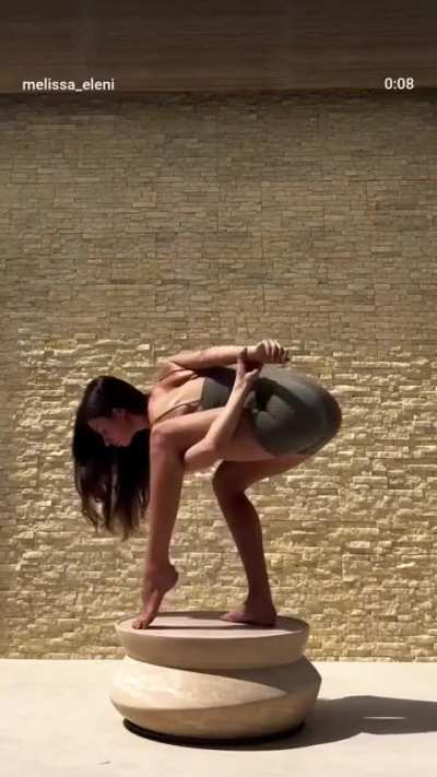 Stretchin' Them (also, what is she standing on?)