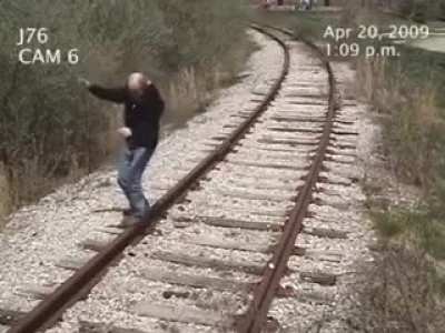 This is why you should always check behind you when walking on a railway track