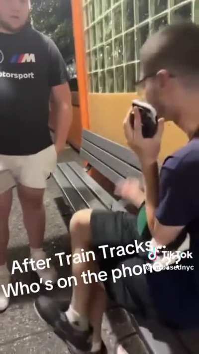Josh talking on the phone after attempting to jump on the tracks