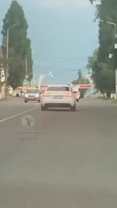 Just a woman behind a police car