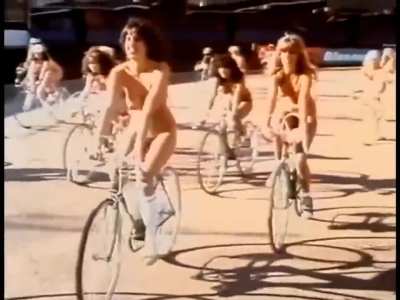 65 nude models, from behind the scenes of filming Queen's "Bicycle Race" music video at Wimbledon Stadium (London, 1978)