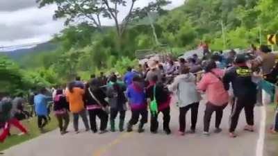 A Group of Strangers Pulls a Car Out of a Ditch
