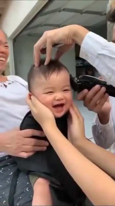 This baby getting a haircut.