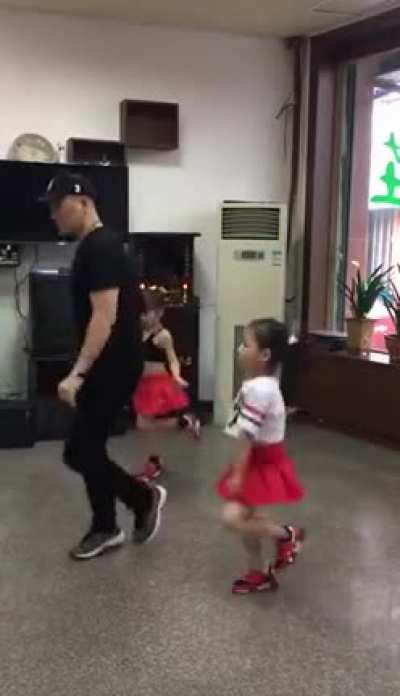 Like father like daughters, dancing like pros.