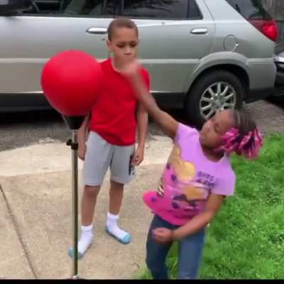 Brother showing sister how it&rsquo;s done.
