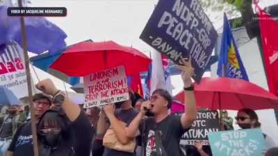 Police in Cebu, Philippines diverting the attention of anti-martial law and anti-marcos &amp; duterte administration protesters by loudly performing a concert of their own (from Rappler)