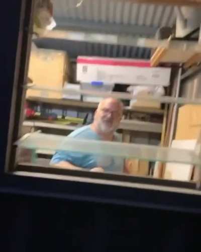 Wife spooks husband through window