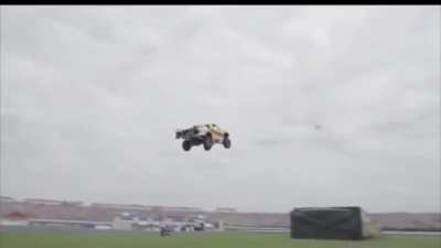 Tanner Foust sets a world record by dropping 90 feet down of the track & soaring 332 feet through the air in Pro 2 truck  