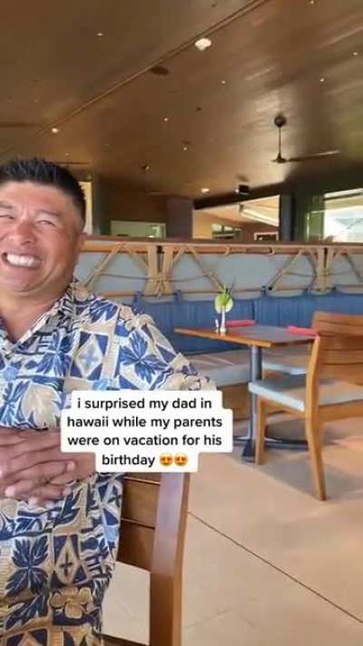 Dad surprised by son on holiday
