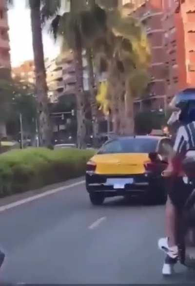That is a child on the back of the bike. Barcelona, today.