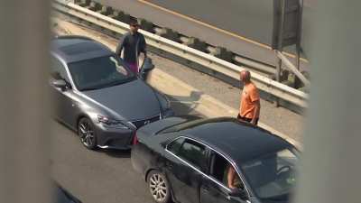 Canadian cop politely handles a road rage incident from atop a bridge during an interview
