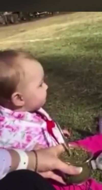 Baby tries herbal tea for the first time