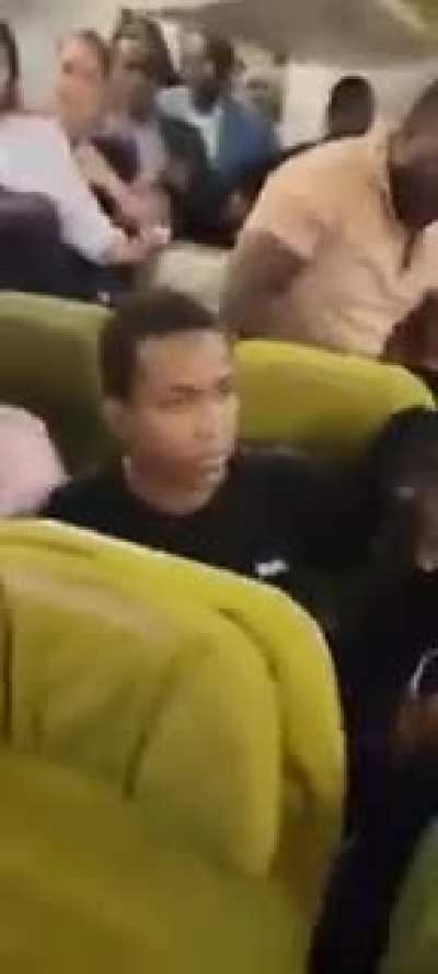 Chinese Thief aboard Ethiopian Airlines caught pickpocketing Ugandans.