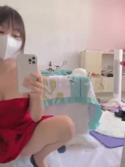 Asian rides a dildo