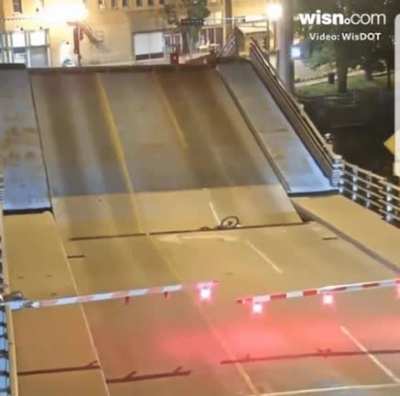 WCGW riding bike on rising bridge