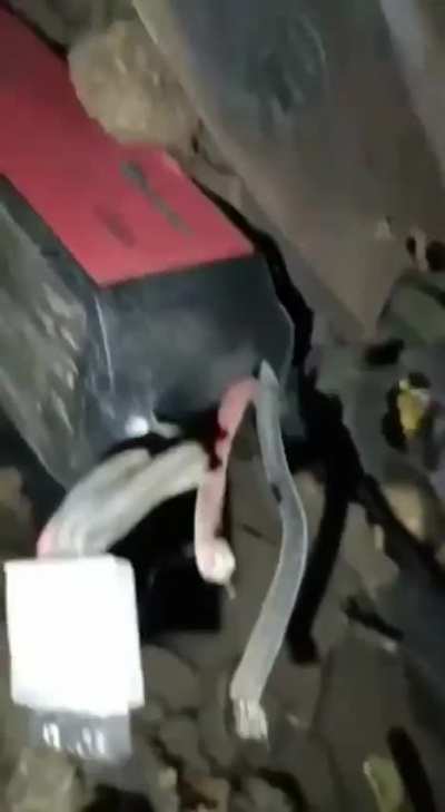 Russians show living conditions under a wrecked armored vehicle, explosions can be heard trying to target them from outside.