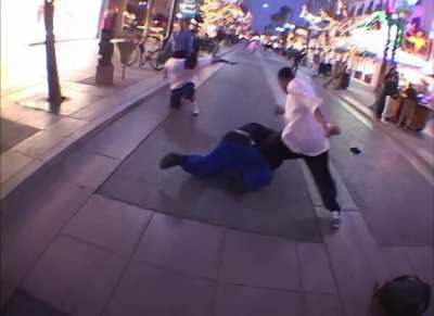 Guy starts a fight with random strangers