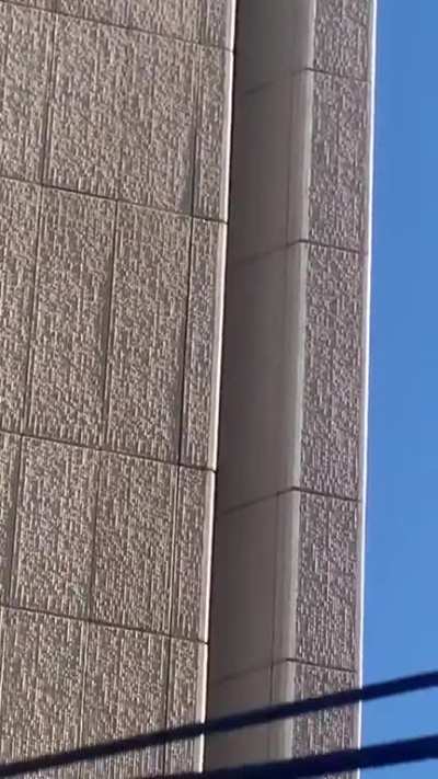 Insane free climber climbing an abandoned building in downtown Phoenix right now