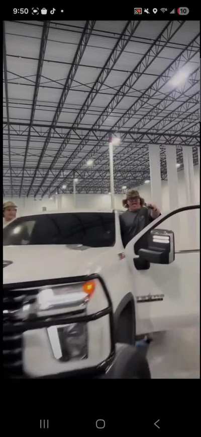 Fat kid flags camera with gun while driving.