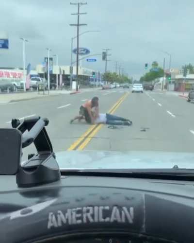 A fight breaks out in the middle of the street in Fullerton