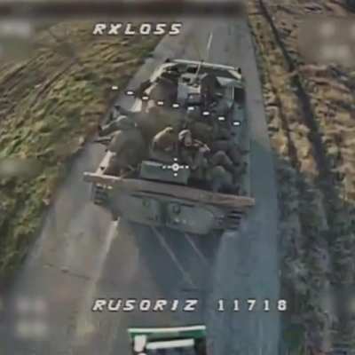 Ukrainian FPV drone&rsquo;s terminal dive onto a Russian BMP-2 with infantry add-on armor