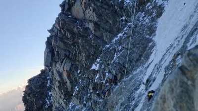 Climber trapped in the middle of a rock collapse on Mont Blanc. The climber was rescued later by helicopter.