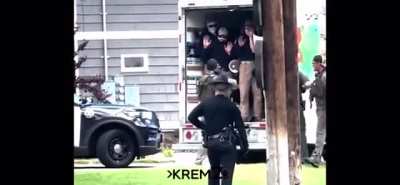 Moment Patriot Front members are exposed by police in Idaho on their way to a Pride Event