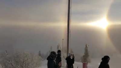 A very rare solar halo is visible over a mountain in Sweden