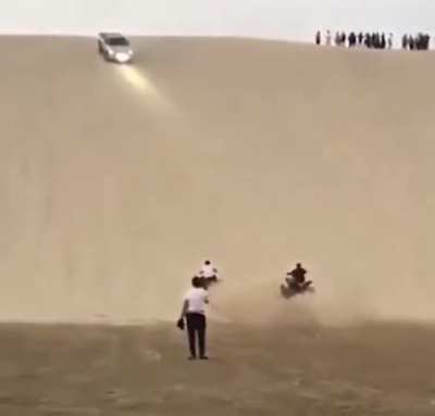 Idiots on a sand dune.