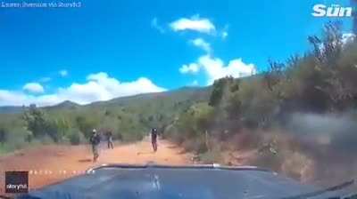 A couple escape a attack by a gang bandits in Africa..