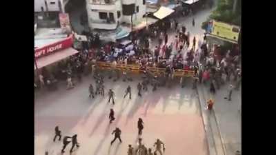 Sikh extremists charge on policemen with swords when they went to their temple to reinforce COVID regulations