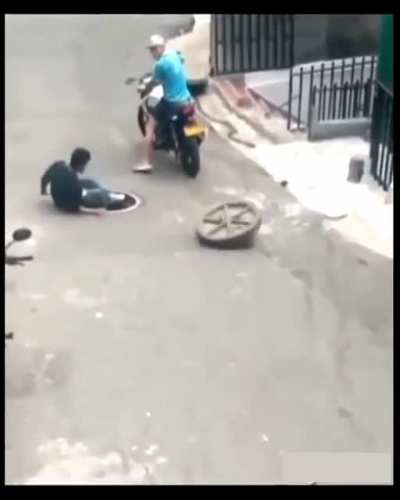 Trying to steal Manhole cover!