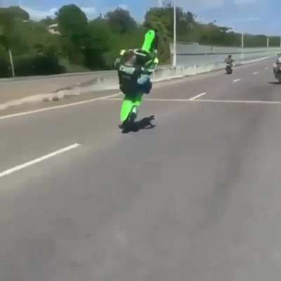 Motorcycle wheelie without a helmet