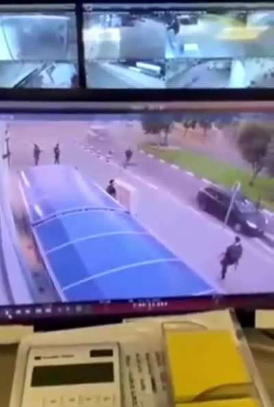 Hamas militant firing an RPG at a civilian vehicle