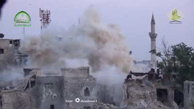 Opposition improvised "Hell Cannon" targets a sandbagged Syrian Army position on a rooftop in Aleppo - 7/6/2015