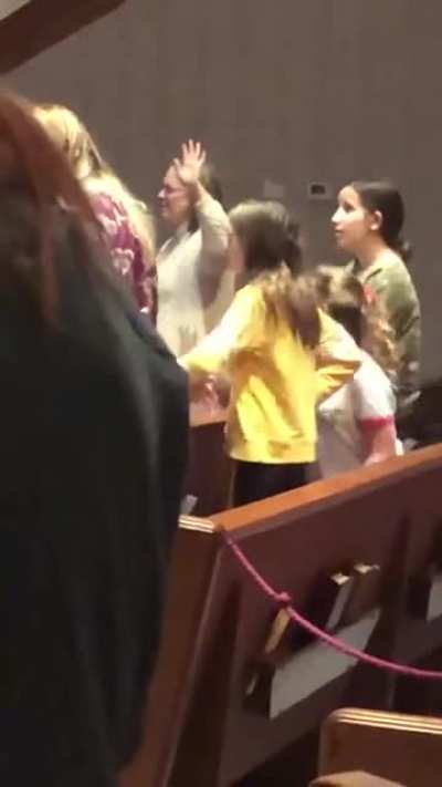 Girl doing Macarena during Sinner&rsquo;s Prayer