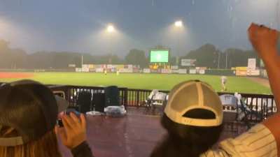 Drunk woman running on Baseball field while on delay due to rain