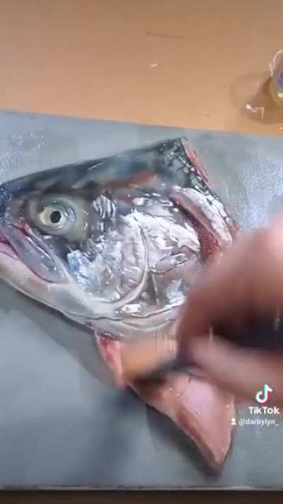 Varnishing my fish head painting!
