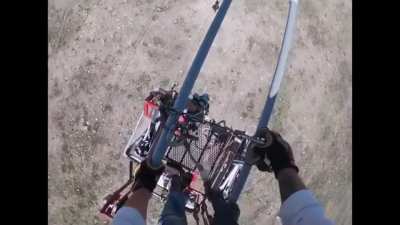 Lineman&rsquo;s cart slips off the wires. He has to fix it so he get get off the lines.