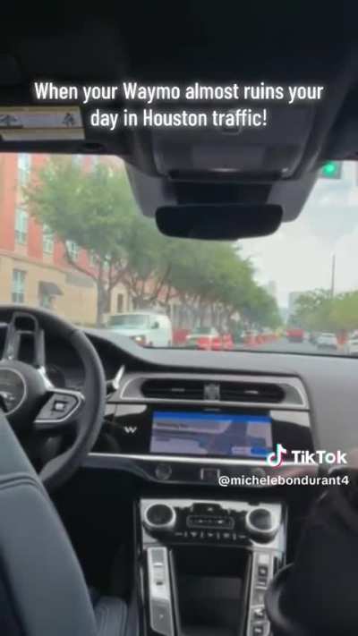 Waymo unprotected left thru construction zone in Houston