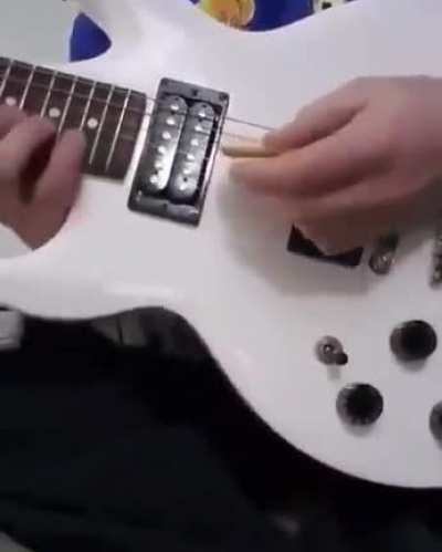 Playing the guitar with a cracker