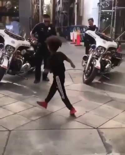 Police officer savagely beats young black child.