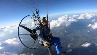 Crazy dude flying a paramotor at 17500 feet