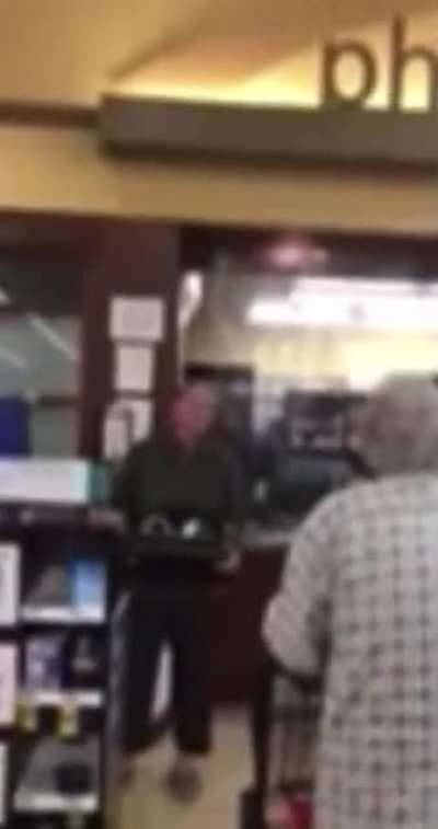 pharmacy manager quits in front of customers warning them not to take the poison after seeing too many people die...