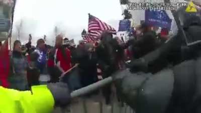 Footage from Jan 6 of the MAGA terrorists getting through a barrier so of anyone says "the police let them in, show them this."