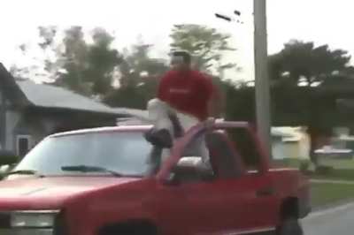 WCGW sitting on a windshield of a moving car as a driver
