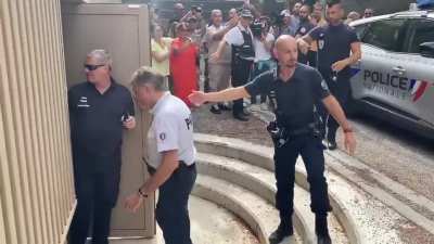 Angry crowd Is barely held back as Millionaire Dentist gets arrested for mutilating his patients from low income neighborhoods with unnecessary work